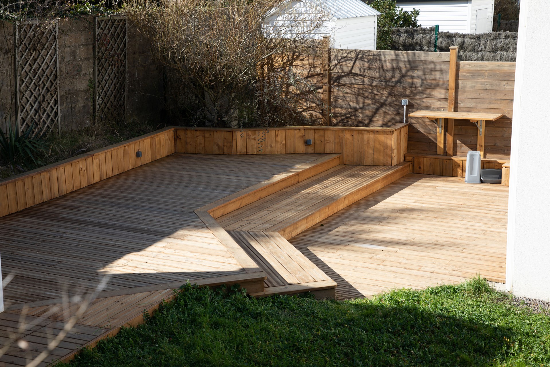 wooden terrace different levels in the garden of the house